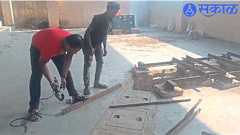 Villagers repairing a broken bed in Ambad crematorium at their own expense.