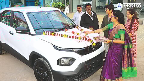 A woman performs pooja after buying a vehicle on Sunday on the occasion of Diwali.