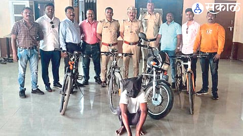 Suspects in custody with stolen bicycles and police officers and staff in action.