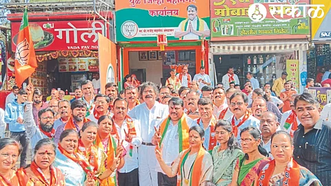 BJP office bearers and activists celebrate BJP's victory in Madhya Pradesh, Chhattisgarh, Rajasthan assembly elections outside the party office in Dhule on Sunday.