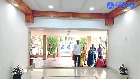 The staff were waiting for the late arrival at the office of the Superintendent of Police.