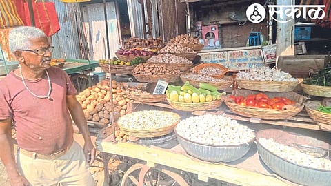 Shankar Dhumal while selling garlic in the Monday market here.