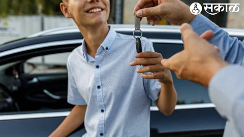 Father with son giving car keys