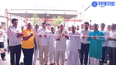 Aadhar Baba Ahire, a progressive farmer, while cutting the ribbon for the Maize Dryer Project of Sumangal Industrial Group.