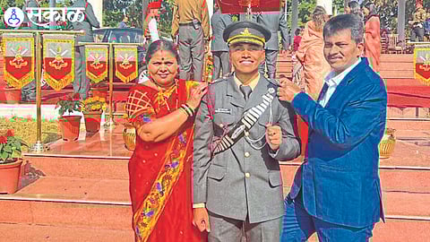 Shubham and his parents during the initiation ceremony.