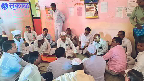 Gram Sevak Neighbor Villager giving information about scam of fake tax receipts in Gram Panchayat Office in Special Gram Sabha.