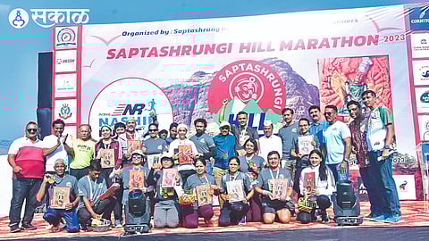 The office bearers along with the winners of the Saptshringi Hill Marathon competition