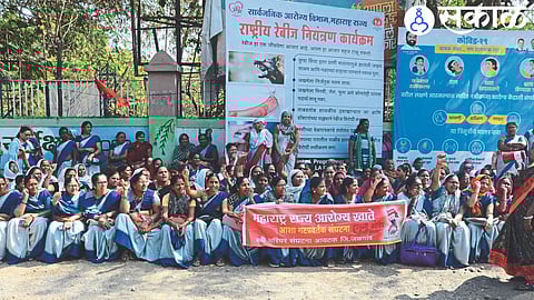 Asha group promoters protesting in front of the collector's office.