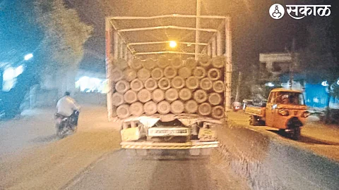 A vehicle transporting oxygen cylinders on Old Agra Road in Malegaon.