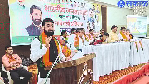State General Minister Vijay Chaudhary office bearer on platform while speaking at BJP meeting