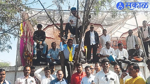 While hanging from a tree and protesting, tribal