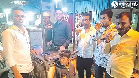 Customers enjoying sorbati tea at Salam Chacha Street in Malegaon.