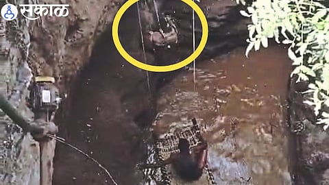 A young man trying to save a black man who had fallen into a well.
