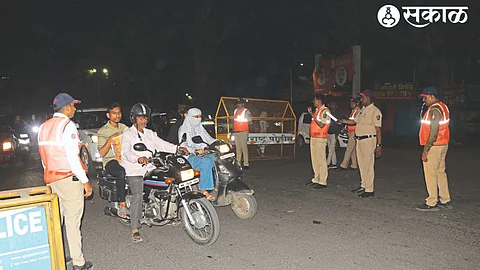 Police checking two-wheelers and four-wheelers in the city on Sunday night.