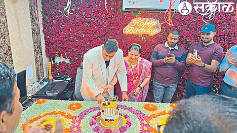 Deputy Commissioner Sudarshan Nagar cutting his birthday cake at the tribal commissionerate office on Wednesday.