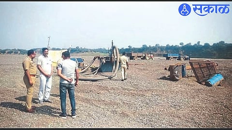 Police inspector Deepak Patil and others while giving panchnama regarding illegal sand mining from Tapi riverbed on Thursday.