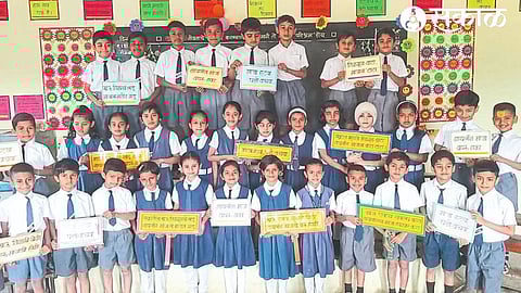 Students of Vainteya Primary Vidyamandir taking the Manjamukti Oath.