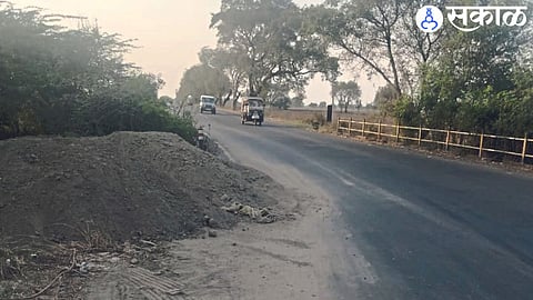 A mound of earth thrown on the road to prevent accidents.