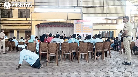 Businessmen bidding at a shopping center brick auction