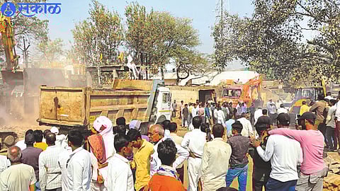 JCB machine while demolishing encroachment in bus stand area.