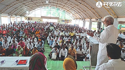 Guardian Minister Dada Bhuse speaking at the distribution program of Gharkul approval order of Shabari Awas, Ramai Awas, Modi Awas Yojana at Krishna Lawns in Malegaon.