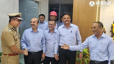 Special Inspector General of Police Sanjay Darade laughing with old colleagues at Gharada Chemical Ltd. in the industrial estate of Khed taluka.