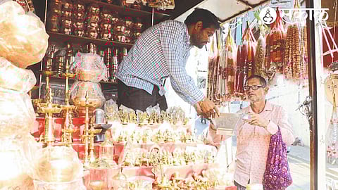 Devotees buying Agnihotra vessels from yagna material shop.