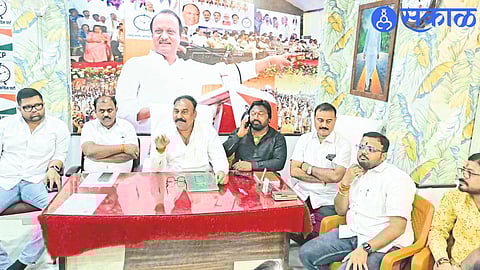 NCP's Dhule City-District President Kailas Chaudhary while giving information about Deputy Chief Minister Ajit Pawar's programs in Dhule.