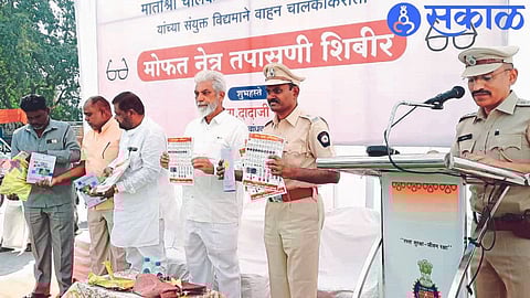 Guardian Minister Dada Bhuse while unveiling the books, brochures of road safety campaign here. Neighbor Sub Regional Transport Officer Vinod Jadhav.