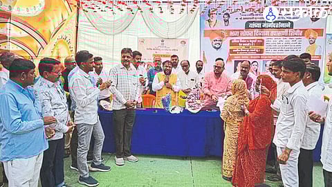 Guardian Minister Gulabrao Patil and others while distributing certificates at the Disability Health Checkup Camp.