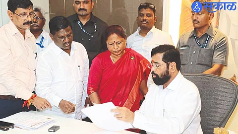 MLA Manjula Gavit and Dr. Tulshiram gavit taking approval of Pimpalner Gram Panchayat from Chief Minister Eknath Shinde.