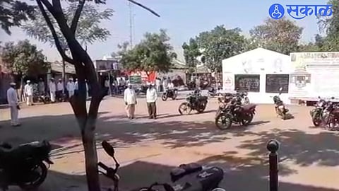 Villagers standing still when the National Anthem starts.