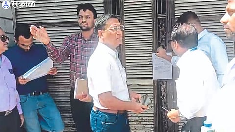 Sub-Divisional Officer Jitendra Patil and staff while sealing Vasant Talkies.