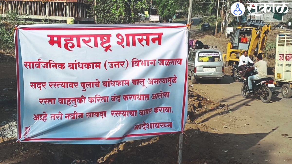 Commencement plaque on Nagziri river and JCB on duty.