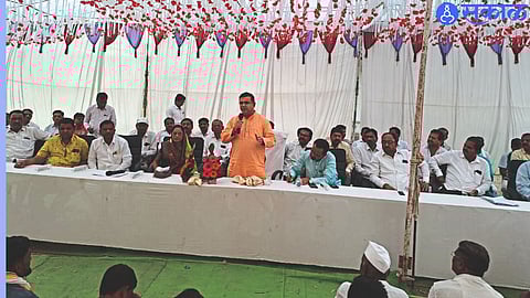 MLA Jayakumar Rawal speaking at the program of distributing irrigation well approval letters to farmers.