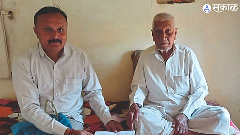 Voter registration officer while filling the application form of senior citizen Shankarrao Deshmukh.