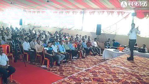Assistant Election Returning Officer Subhash Dalvi guiding the employees appointed for the Lok Sabha elections through a slide show in the workshop.
