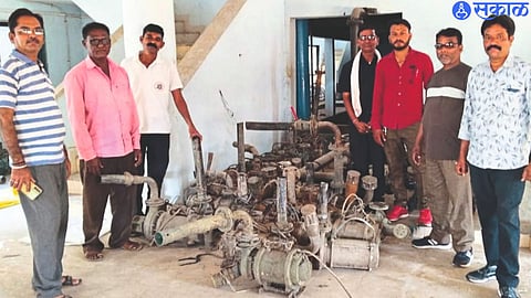 motor seized from kt dam by municipal team. Neighboring municipal employees.