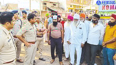 Police officers while discussing with the villagers in Umarti village, which is a base of illegal arms manufacturing