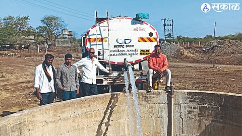 Tanker pouring water into the well employees