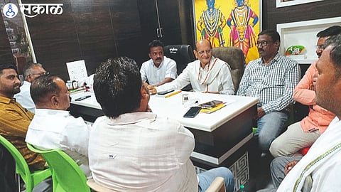 NCP District President Adv. Ravindra Patil while interacting with office bearers and workers.