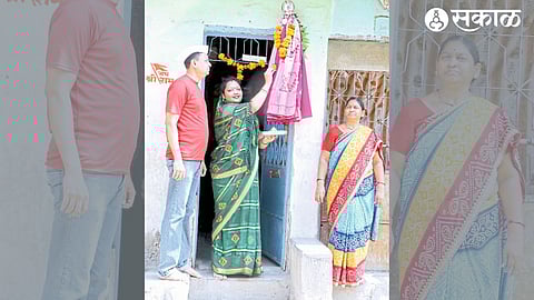 Couple worshiping the Gudi erected in front of the house