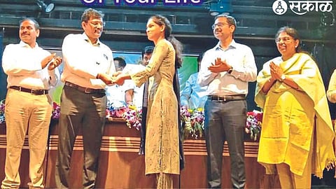 Sonali Gangurde accepting appointment letter at a program held here.