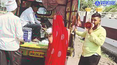 Youth selling fruit from a four-wheeler in rural areas.