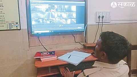 Staff monitoring railway station through CCTV at RPF office.