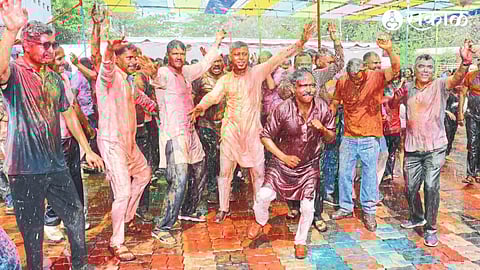 Police officers, personnel enjoying shower Rangpanchami in the city police headquarters premises.
