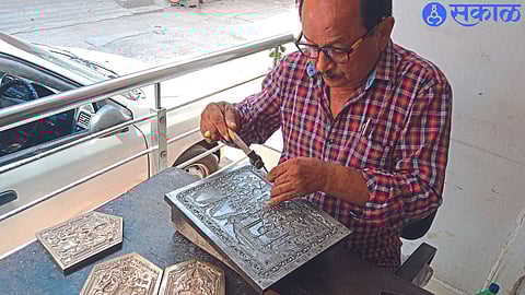 Somnath Jade while shaping the idols with the help of 'die'.