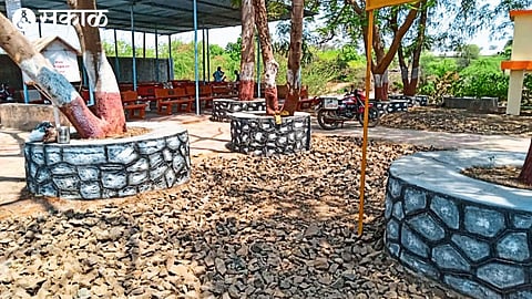 Donated cement pails at a cemetery in Nampur, second photo attractive colored stone ottos built around trees