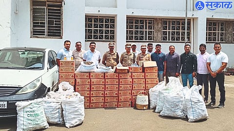 Superintendent of Police Shravan Dutt S., Additional Superintendent of Police Nilesh Tambe, along with fake liquor manufacturing materials and liquor bottles seized by the local crime branch team.