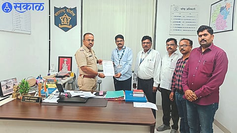 Officials of Gramsevak Union giving a statement to Police Inspector Sambhaji Gaikwad.
